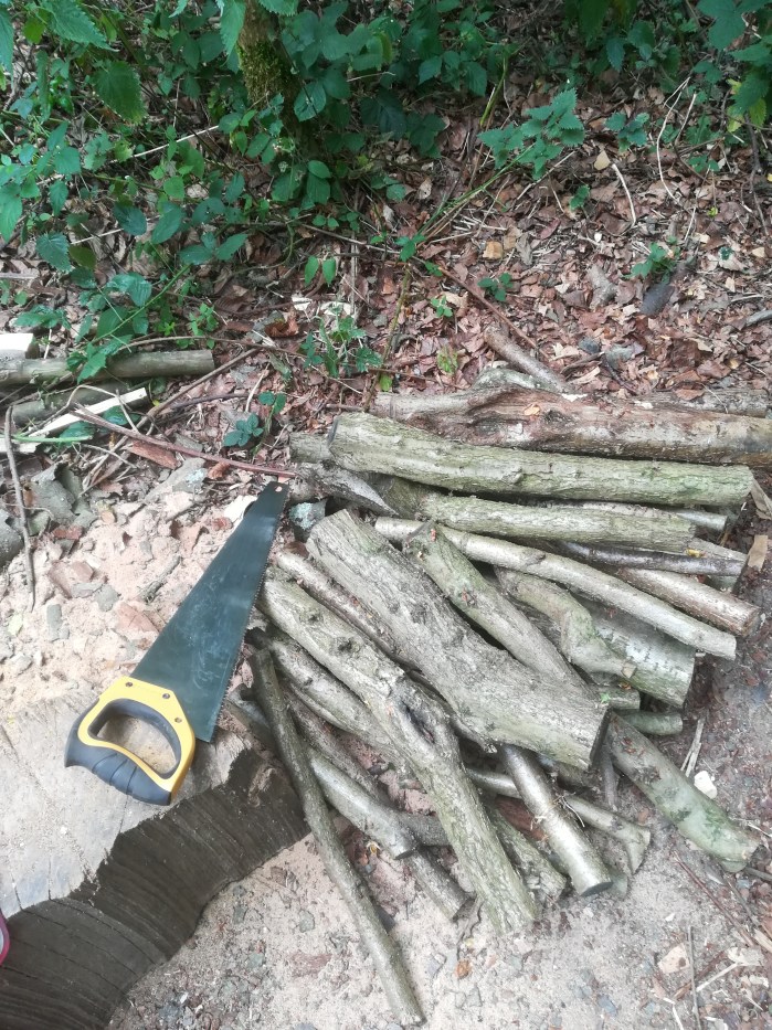 coppiced hazel branches ready to be prepared for the charcoal retort